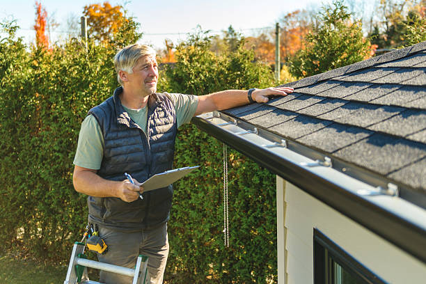 Professional Hail Damage Roof Repair technician working in Orchard, CO